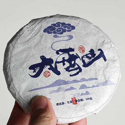 Yunnan Natural and Additive-free Puerh Tea Old Tree Tea 100g Daxue Mountain Small Cake Raw Tea Tea Green Tea 云南普洱茶老树茶 100克大雪山小饼生茶 茶叶