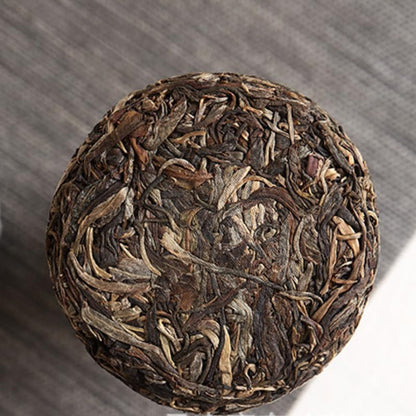 Natural and Additive-free Pu'er Tea Lexingxiang 100g Iceland Spring Tea for Travelling and Office Use (Mooncake Shape) Raw Tea Green Tea 普洱茶100克冰岛 明前春茶旅游办公用茶（月饼形状）