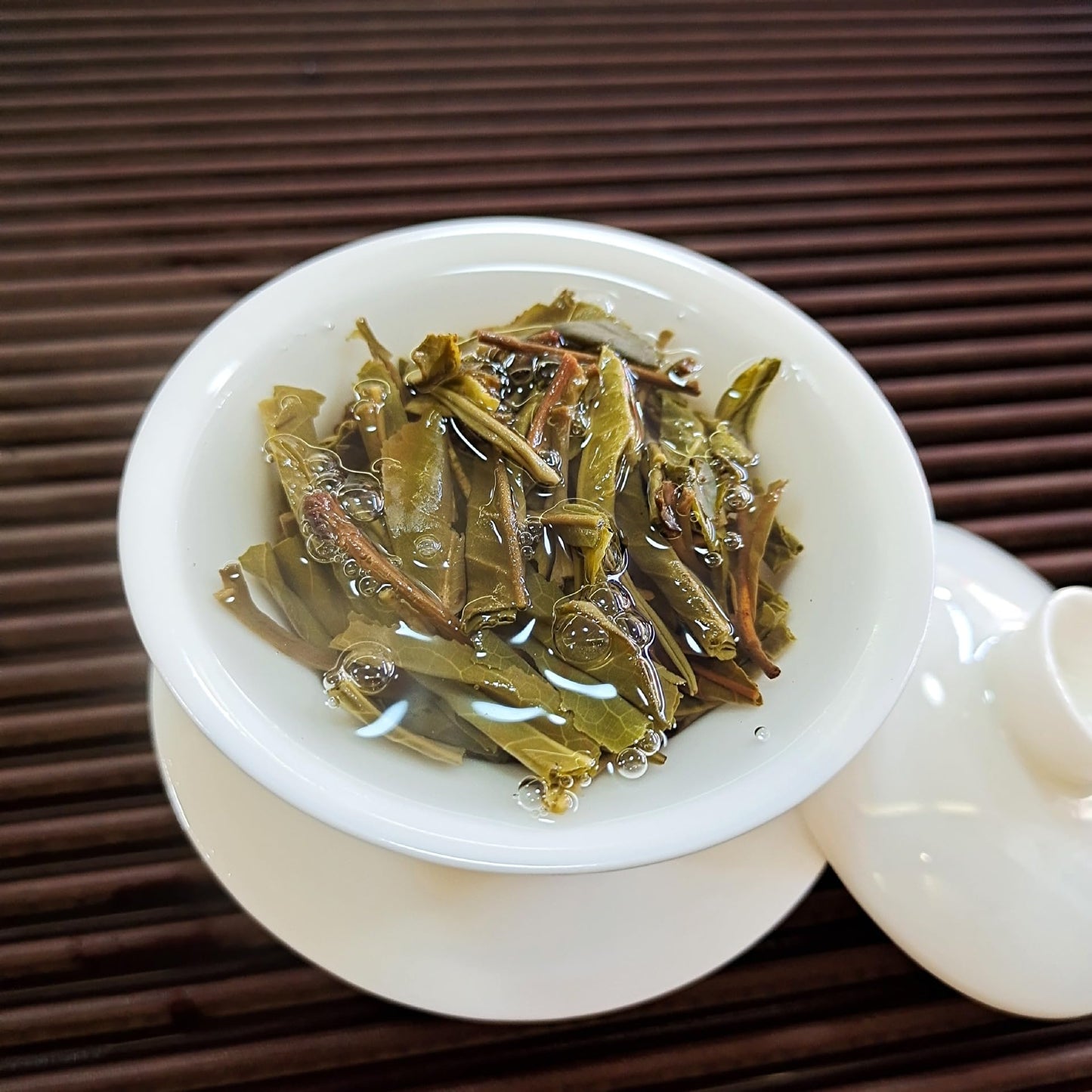 Natural and Additive-free Yunnan Puerh Tea Raw Tea Yiwu High Pole Ancient Tree Raw Tea Green Tea 357g Deliciously Smooth Puerh Tea 云南易武高杆古树生茶 七子饼357克